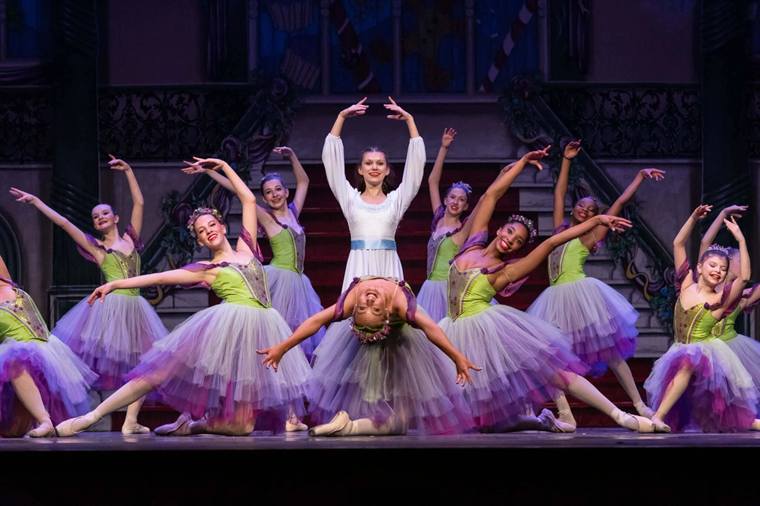 Dancers in costume on stage during a Nutcracker performance